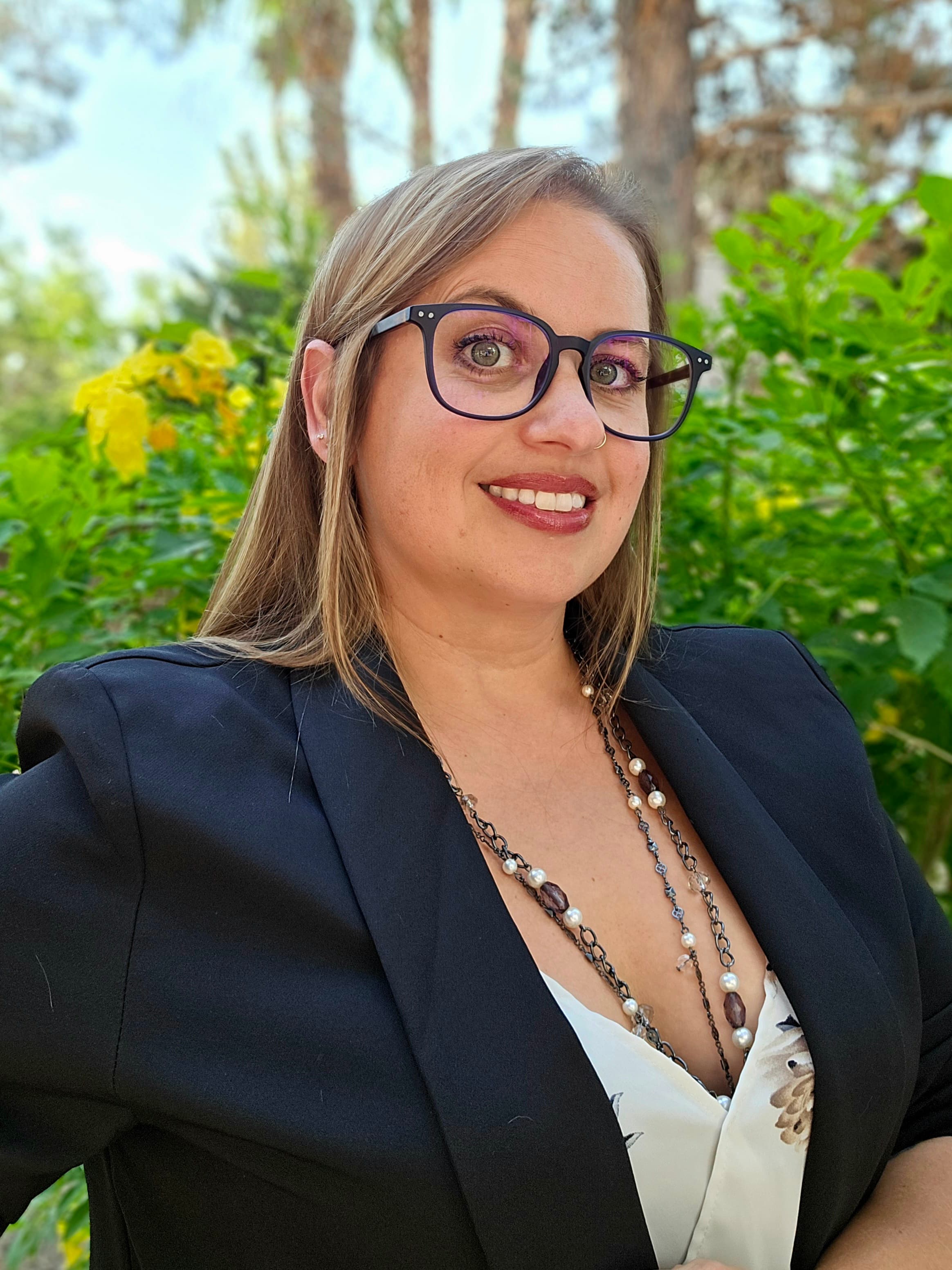 Kerri Lynn in a black blazer outdoors