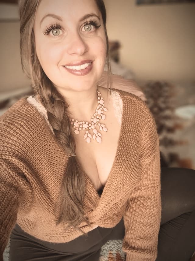 Kerri Lynn in a knit sweater with a braid